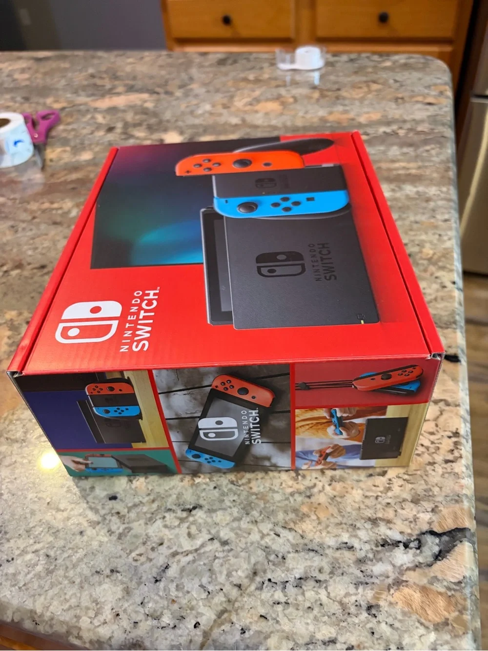 Nintendo Switch with Neon Blue Left and Neon Red Right Joy-Con